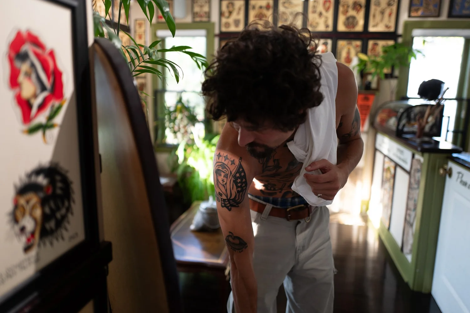 Tattoo artist in studio